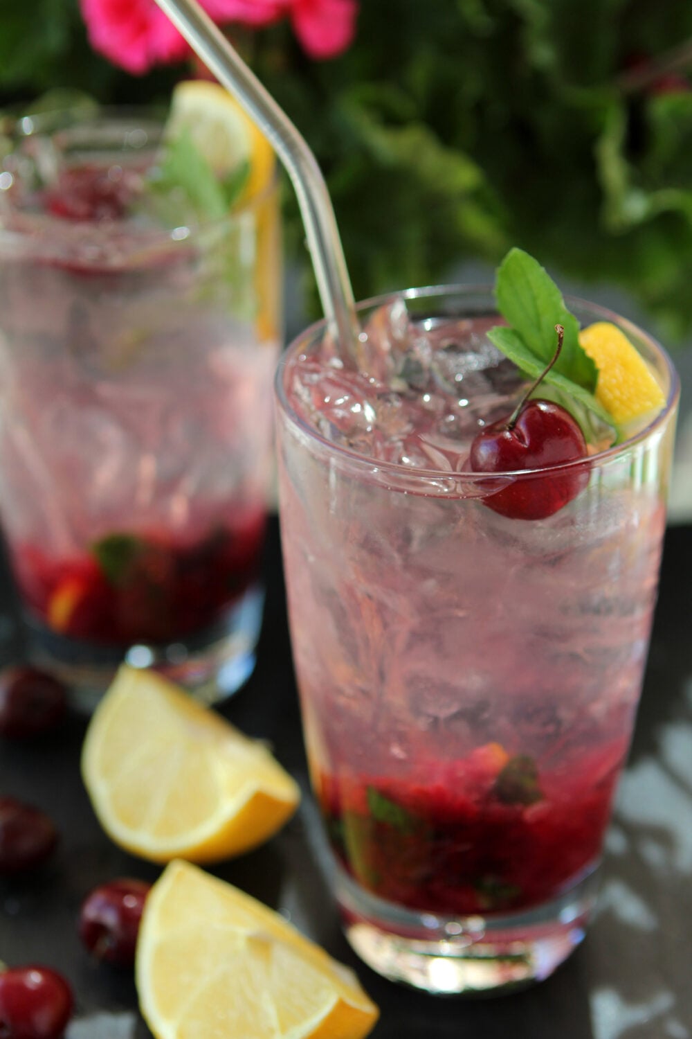 Cherry Lemonade Vodka Spritzer with ice in a Collins glass.