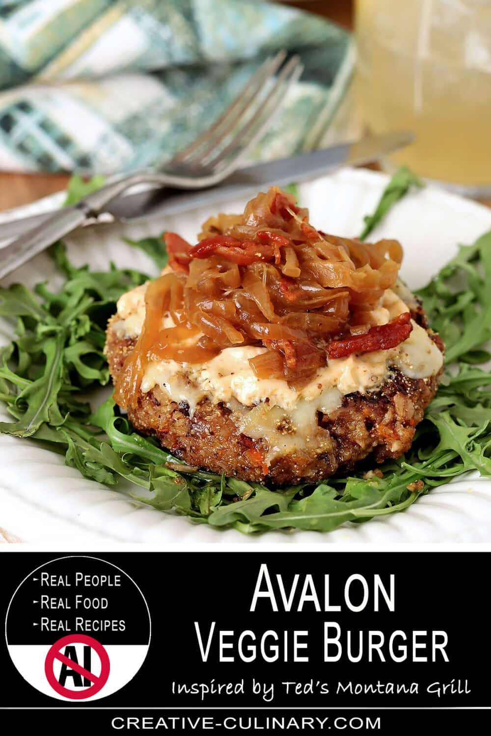 Vegetarian Avalon Veggie Burger with caramelized onions on a bed of greens.