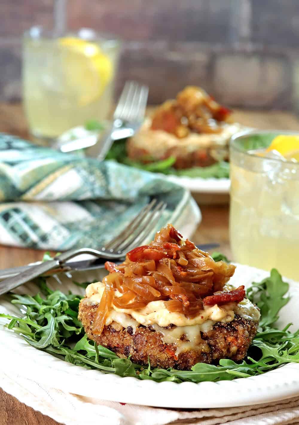 Close-up of Avalon Veggie-ish Burger with caramelized onions and greens.