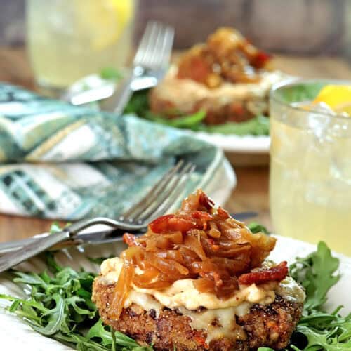 Close-up of Avalon Veggie Burger with caramelized onions and greens.
