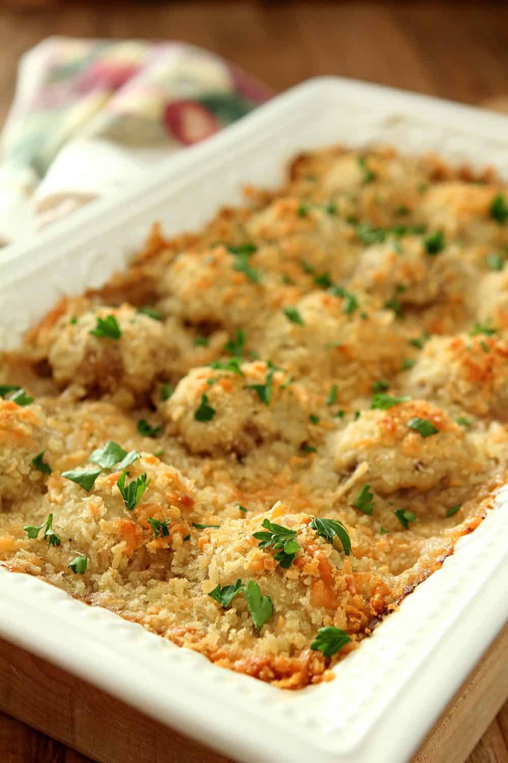 Casserole dish with Baked Mushrooms in a Parmesan Cream Sauce topped with panko crumbs.