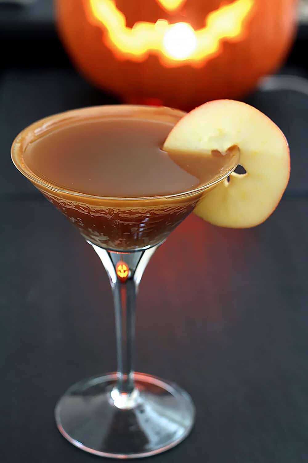 Caramel Apple Martini with apple slice garnish.