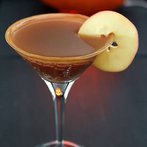 Caramel Apple Martini with apple slice garnish.