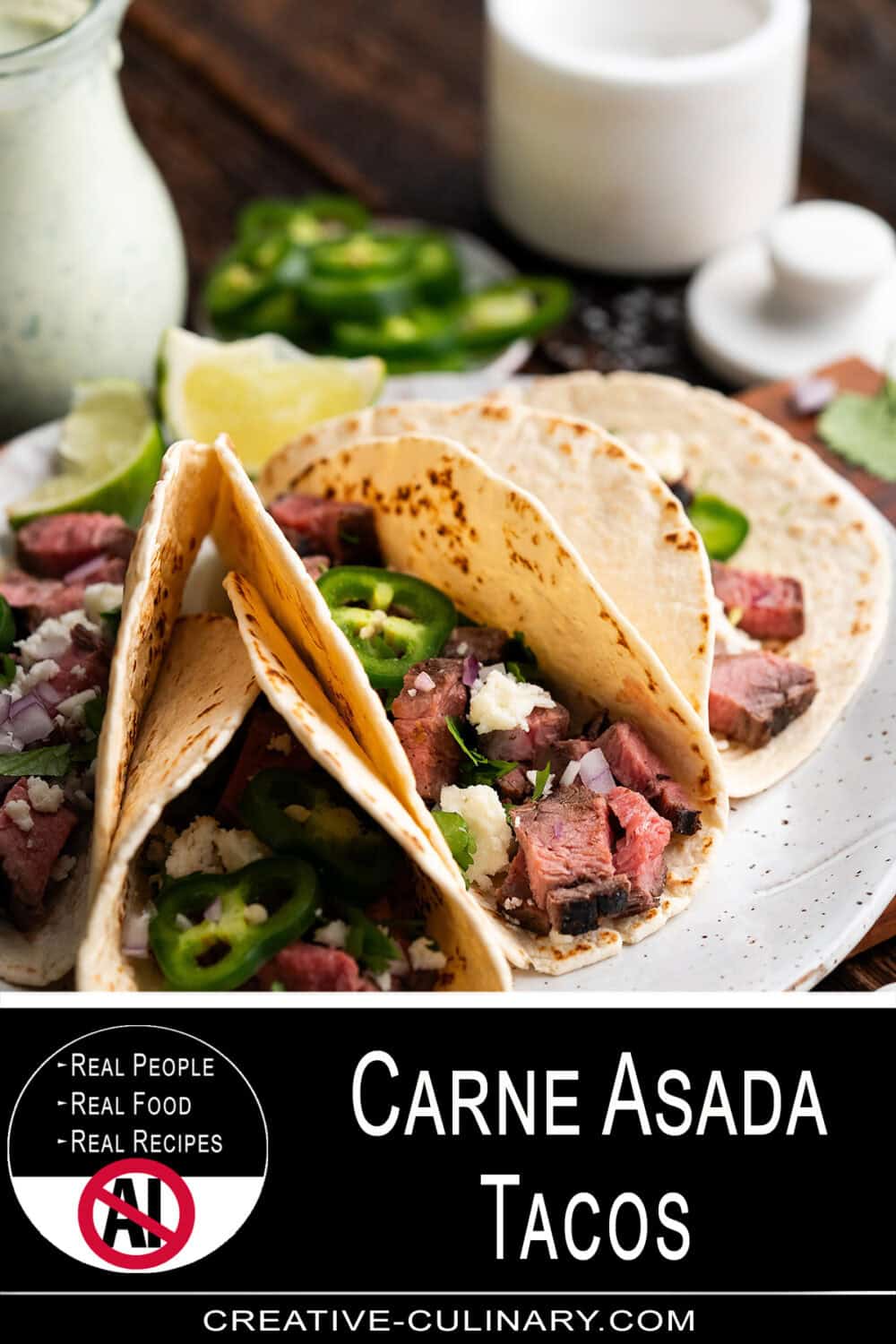 Delicious carne asada tacos with fresh jalapenos and onions on a white plate.