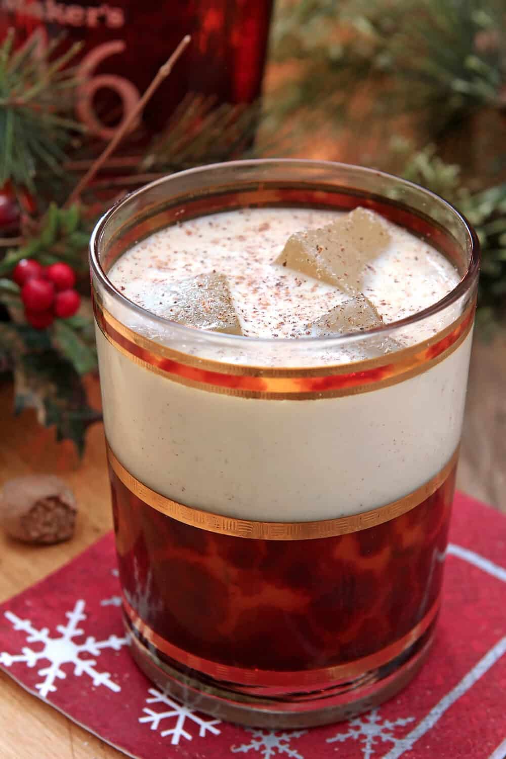 Closeup of Vanilla Bean Eggnog with nutmeg and cinnamon sprinkled on top.