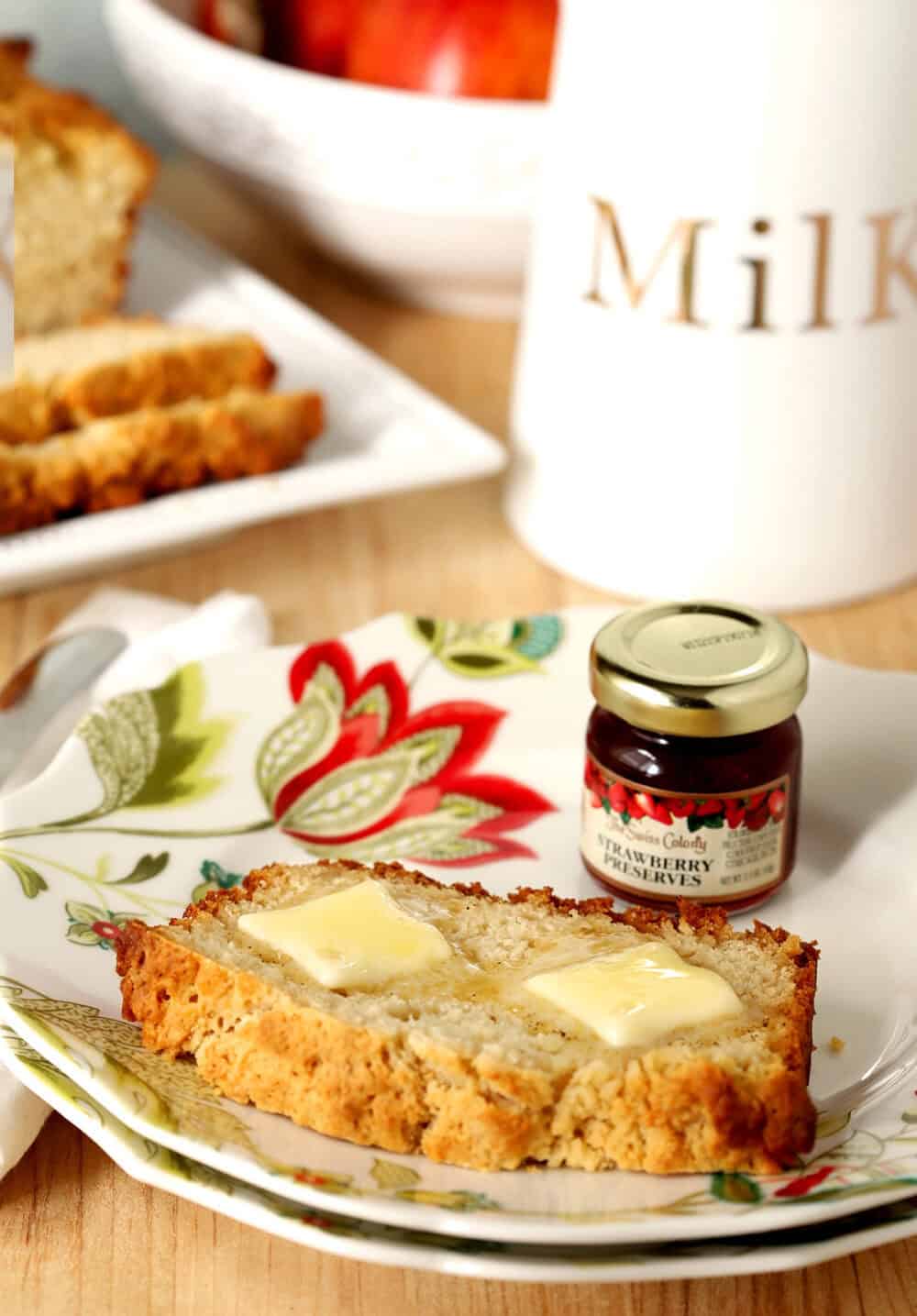 Close-up of honey butter beer bread with butter slices on top.