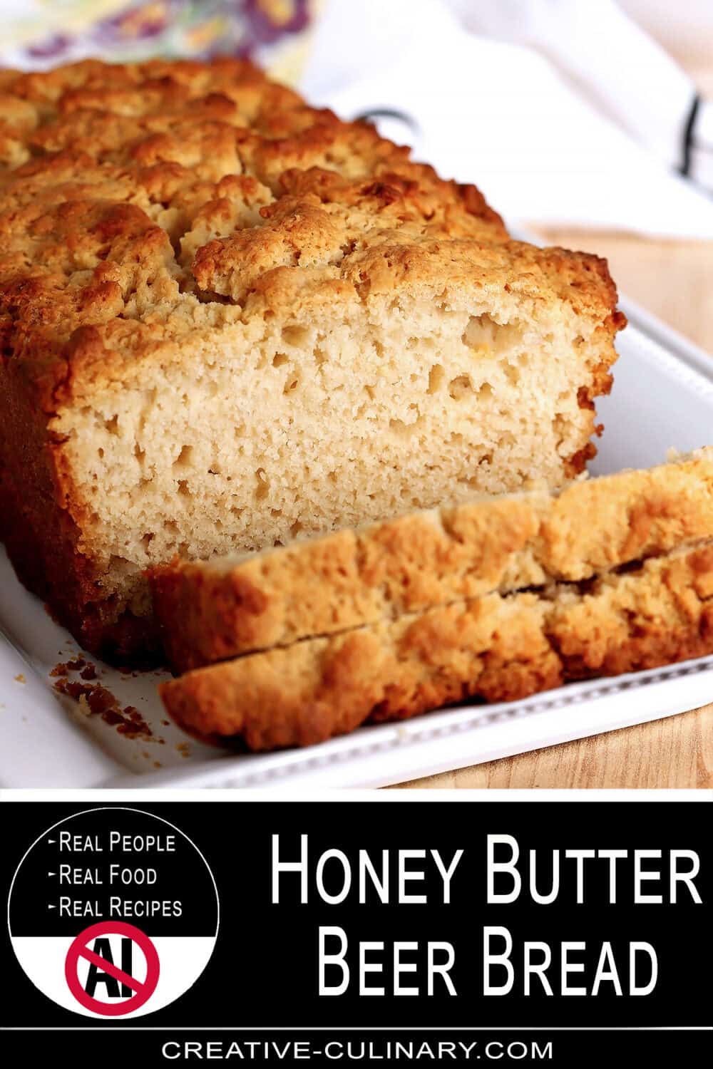 PIN for close-up of honey butter beer bread with a slice cut out.