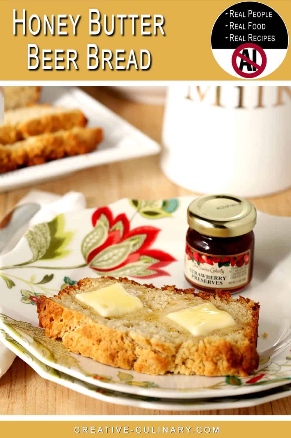 Slice of honey butter beer bread with butter and jam jar on floral plate.