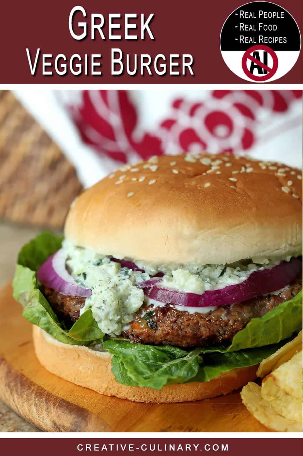 Close-up of a Greek veggie burger with lettuce, onion, and feta cheese.